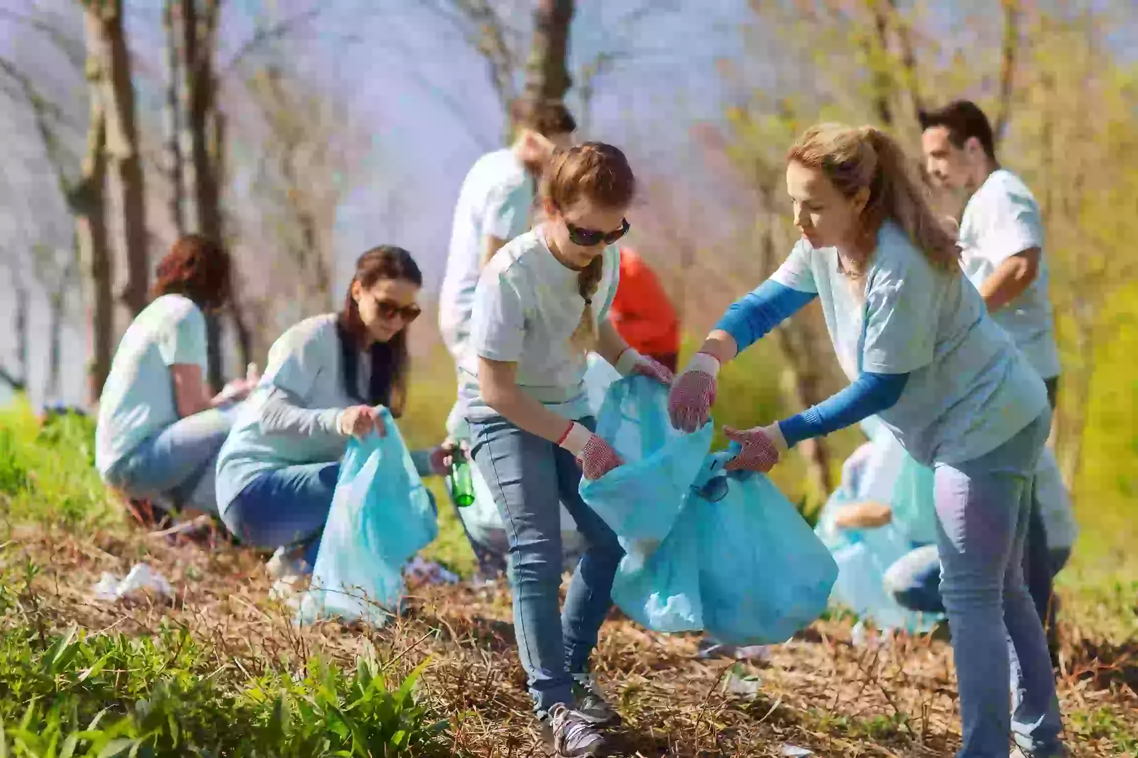 volunteers cleaning up a park